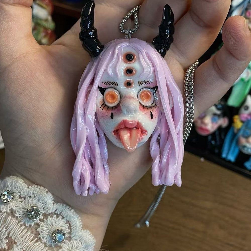 Lavender Horned Doll Face Charm
